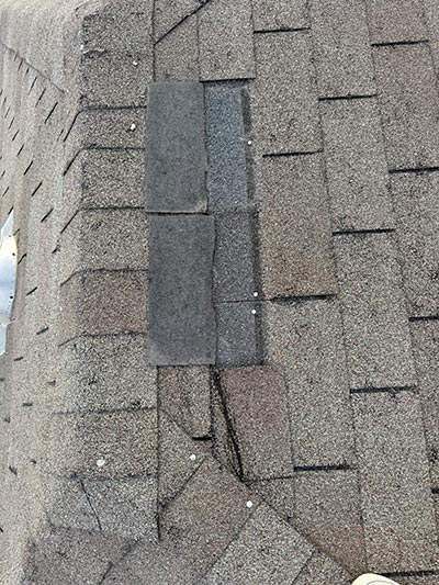 Replacement shingle patch blended into an existing architectural shingle field in Haslet, TX