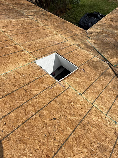 New OSB roof decking with a cut opening for a roof penetration in Haslet, TX